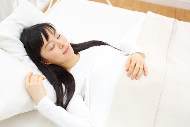 beautiful young woman sleeping in bed