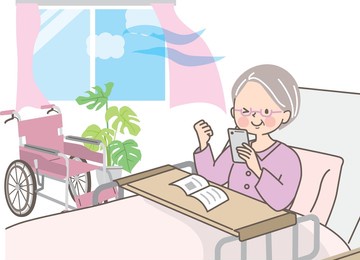 smiling grandma learning how to use her smartphone while in the hospital