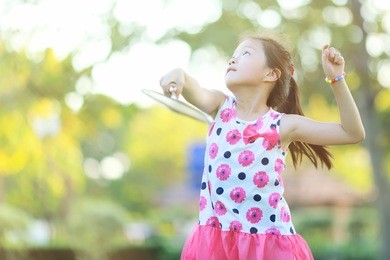 cute little girl playing badminton 