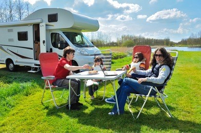 family vacation, rv (camper) travel with kids, happy parents with children on holiday trip in motorhome 