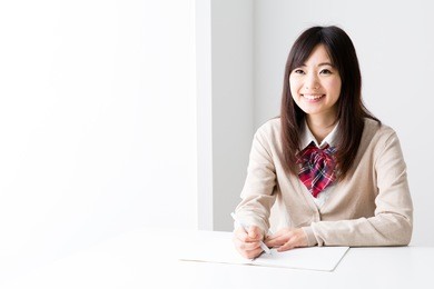 young asian student studying in the white room