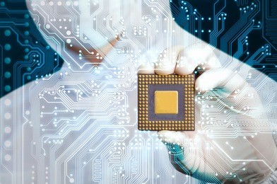 scientist in jumpsuit holding microchip and electronics circuit glow