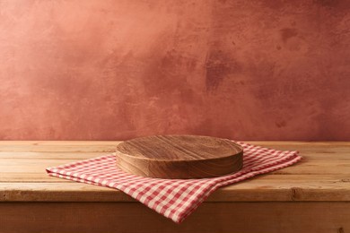 empty podium on wooden table with tablecloth over rustic wall  background. kitchen interior mock up for design and product display