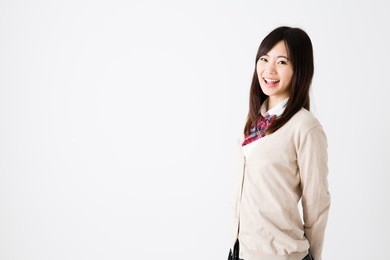 portrait of young asian student on white background