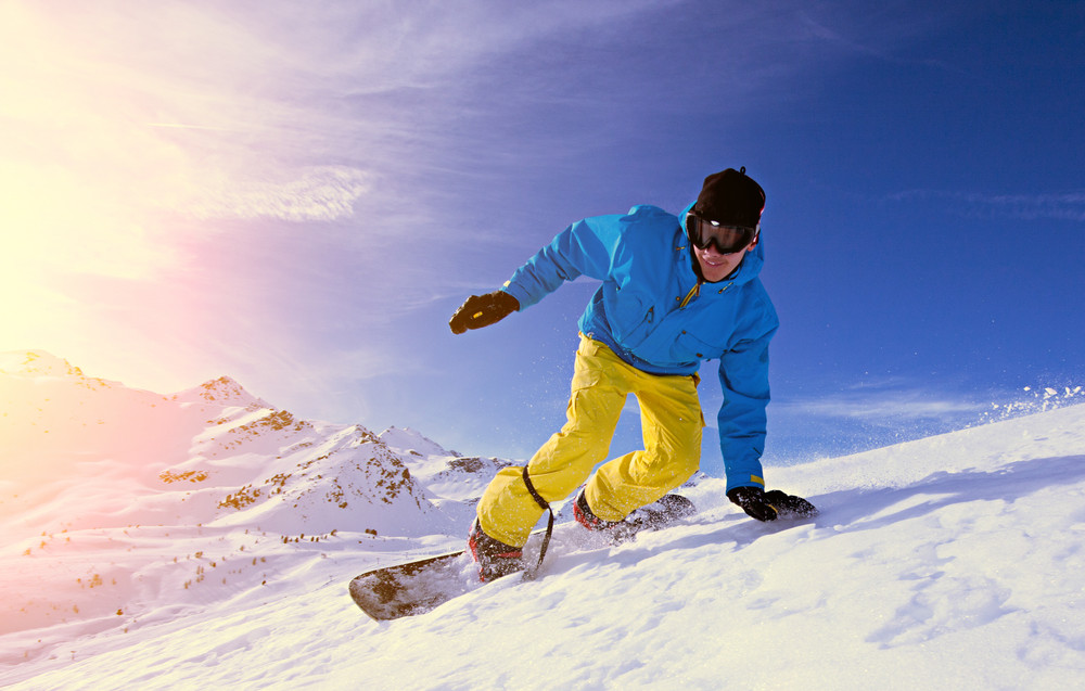 young man snowboarding.