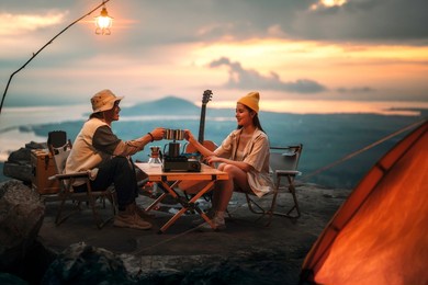 asian couple sweet in tent inside on they camping trip, traveller relax and sleep togather in out door and camping trip