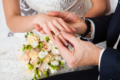 the groom wears the ring bride. wedding ceremony.