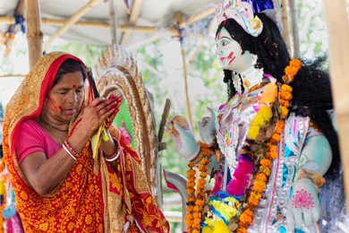 local rural woman worshipping godess in the village
