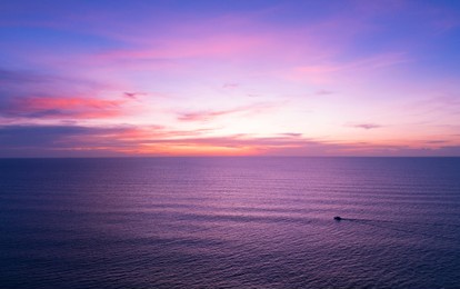 aerial view sunset sky, nature beautiful light sunset or sunrise over sea, colorful dramatic majestic scenery sky with amazing clouds and waves in sunset sky purple light cloud background