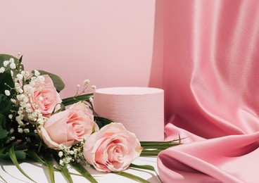 romantic pastel pink composition. satin curtain and bouquet of pink roses. suitable for product display and business concept. modern aesthetic.