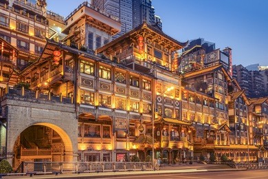 chongqing, china at hongyadong hillside buildings at twilight.