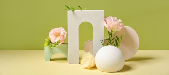 empty modern podiums with flowers on green background