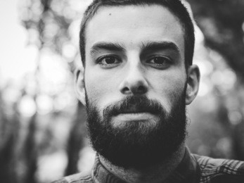hipster man portrait  in black and white in horizontal composition.