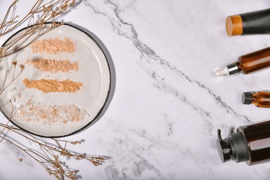 face powder smear, shade of natural cosmetics make up, different tones of organic mineral powder and reusable glass package.