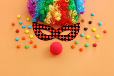 carnival, party and purim celebration concept (jewish carnival holiday) over yellow background