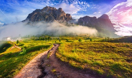 tofane mountain range at sunny foggy morning. view from falzarego pass. dolomites mountains, italy, europe.