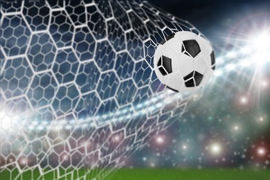 soccer ball in goal net