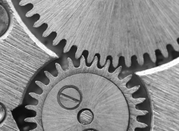 black white background with metal cogwheels a clockwork. conceptual photo for your successful business design. macro. 