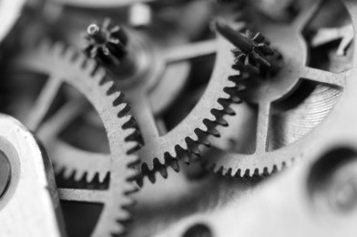 black white background with metal cogwheels a clockwork. conceptual photo for your successful business design. macro. 