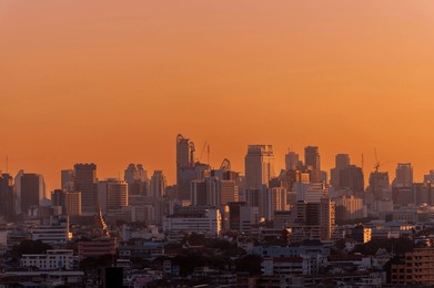 cityscape of bangkok city skyline with sunset sky background, bangkok city is modern metropolis of thailand and favorite of tourists