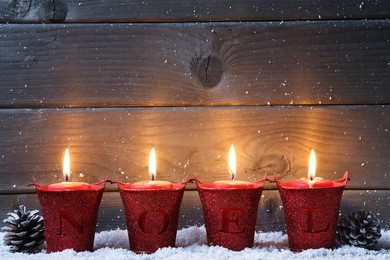 wooden background with christmas candles