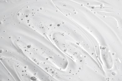 clear gel serum texture. liquid skincare cream background. cosmetic gel product with bubbles close up