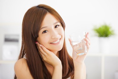 young attractive woman with clean water