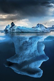 big iceberg underwater with a small part floating