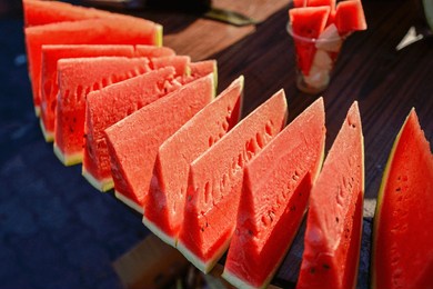 watermelon vendors at a market in urumqi, xinjiang, china