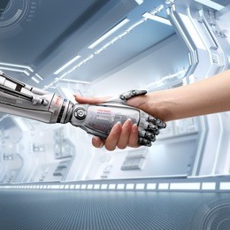 female human and robot's handshake as a symbol of connection between people and artificial intelligence technology
