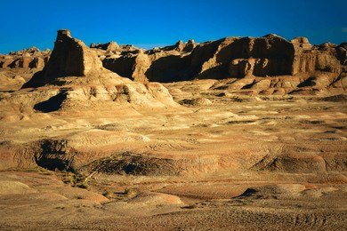 the ghost city is a typical yardang landform. the huge stone pillars of varied shapes in the gobi make magnificent scenery.
