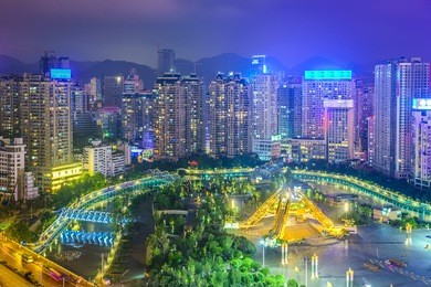 guiyang, china cityscape over people's square at night.