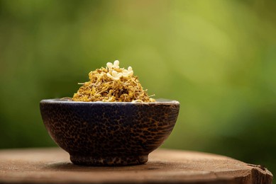fresh and dried sweet osmanthus flowers on nature background.