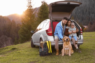 parents, their daughter and dog near car in mountains, space for text. family traveling with pet