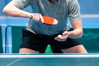 close up of a professional table tennis player serving