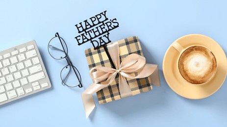 happy fathers day banner. vintage gift box, keyboard, glasses, coffee cup on blue table. flat lay, top view.