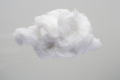cotton wool cloud isolated in grey background with text space. clouds made of real cotton