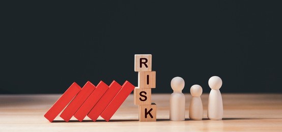 financial crisis, economic, business risk management concept. risk word on wooden block, domino crisis effect. concept risk, crisis, management, assessment, insurance, security, financial, economic