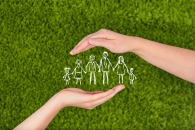 two woman's open hands making a protection gesture  isolated on green background.family life insurance, protecting family, family concepts. 
