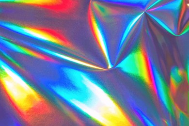 abstract holographic background 80s, 90s, 2000s style. modern bright neon blue, green, red, orange colored metallic psychedelic optimistic rainbow foil texture. new wave, psychedelic retro futurism