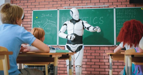 automatic human-like robot standing in front of class with pupils and teaching them of robotics. male teacher. humanoid concept. learning tech at school. technology for studying. android teacher.