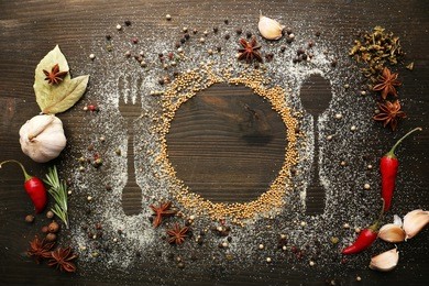 spices on table with cutlery silhouette, close-up 