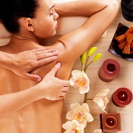 adult woman in spa salon having body relaxing massage. 