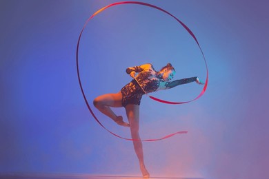 rhythmic gymnastics. rhythmic gymnast girl in action.