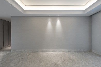 view into an empty living room with walkway