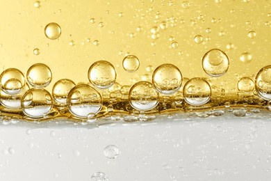 close up of essence liquid lotion bubble layered skin care product raw materials