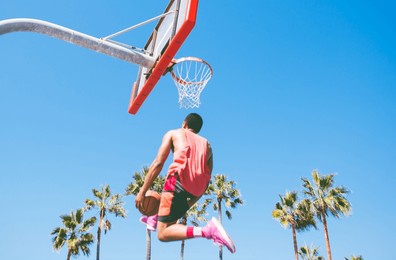 basketball slam dunk on a californian court