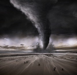 a tornado taring across a deserted beach