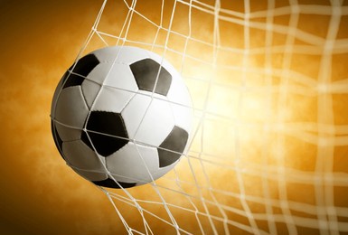 soccer ball in goal with spotlight