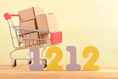 double twelve numbers and a shopping cart filled with delivery boxes